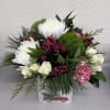 Looking for something to brighten someone's day?
This elegant Christmas arrangement is sure