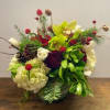 hydrangea, roses, glob amaranth  and succulents.  A festive mix that