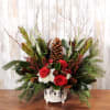 Mix of red and white florals with mixed greenery and pinecones in