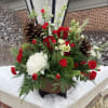 This grand arrangement will make the perfect centerpiece for any holiday party.