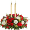 The &quot;Candlelight Enchantment&quot; centrepiece brings warmth and magic to your holiday celebrations.