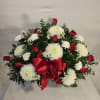 This beautiful, tasteful arrangement of classic red roses and white mums is