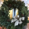 This Wreath is made with fresh, sustainable evergreens that includes cedar, fir
