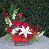 White Snapdragons, red roses, red carnations, white lily, white chrysanthemums, pine cones