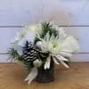 A petite all white winter arrangement with white roses, white cremon crysanthemum