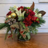 Red roses, white lily, yellow stock, green buttons and red alstromeria arranged