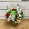 Red roses and green chrysanthemums bring classic Christmas color alongside fragrant white