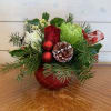 Red roses, green and white chrysanthemums, white hypericum berries and holly arranged