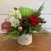 red roses, green chrysanthemums, green hypericum berries and white alstroemeria arranged in