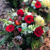 A gorgeous mix of fresh seasonal flowers and evergreens. The perfect way