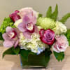 Share your feelings with this lovely arrangement of roses, orchids, hydrangea and