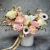 Golden Grace
Soft blush, ivory, and peach blooms paired with golden accents create