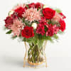NEW The very definition of merry and bright, this bouquet brings both
