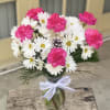 Make any day a happy one with this hand created arrangement and