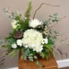 White flowers, curly willow, Lotus pods, and a mix of seasonal greenery