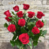One Dozen Premium Red Roses Arranged in a Clear Glass Vase With