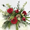 Arranged in a gold bowl- this arrangement includes stunning seasonal blooms.