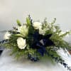 A beautiful mix of blue and white flowers, designed to bring a