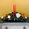 This traditional Christmas centerpiece with glowing candles will take you home for