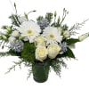 Gerberas, Roses, dianthus and lisianthus designed in a glass vase with Christmas