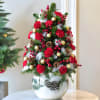 Bring home the holiday cheer with this festive glass vase arrangement featuring
