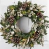 Our winter-themed wreath is a celebration of the season&rsquo;s splendid beauty. Crafted