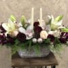 White orchids, purple Cymbidium orchids, white and red roses, in a silver