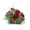 Assorted seasonal greens in a rustic wood container accented with twine. Red
