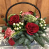 Beautiful Basket With Seasonal Flowers and Fresh Evergreens. 