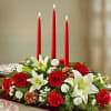 Beautiful long and low centerpiece with white lilies, red roses red carnations