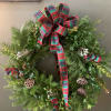 Beautiful wreath decorated and ready to hang on your door. Exact decorations