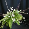 Premium silver / blue accents and all white winter flowers create the