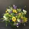 Vase filled with wildflowers. Exact flowers included may be substituted due to