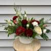 Make an unforgettable impression with our Holiday Cheer arrangement, a luxurious blend
