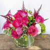 This pink arrangement features hot pink and pastel pink roses, accented with