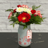 A perfect Christmas bouquet - nestled in an adorable candy cane vase!