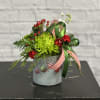 Adorable hanging ornament vase full of festive blooms.  The perfect way