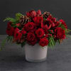 Holiday colors come to life in this stunning holiday arrangement. This modern