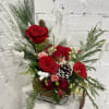 Beautiful Christmas Sleigh floral arrangement with snow brunches and pines.