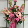 Shades of pink designed in a traditional style make this bouquet perfect