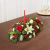 Beautiful long and low centerpiece with white lilies, red roses red carnations
