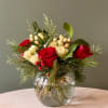 Red, white, and green floral arrangement.
Featuring:
- Ecuadorian Roses
- Spray Roses
- Hypericum
- Styled