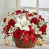 Festive Holiday basket with winter greens, red roses, white lilies, alstromeria, ribbons