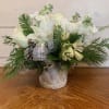 All white flowers including an assortment of roses, lilies, stock, chrysanthemums and