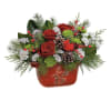 One sided fresh floral arrangement with red and white flowers , pinecones