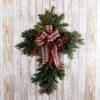 This fresh evergreens cross measured 28&quot;, is decorated and comes delivered with
