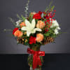 Vase arrangement with Frilly Peach Roses, Red Carnations, Ilex Berry, Cedar, Eucalyptus