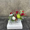 Novelty Rain Deer sleigh filled red roses, carnations, pine cones, berries, chrysanthemums