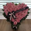 Beautiful and sweet floral bouquet with light pink roses, heart-shaped, organic ruscus
