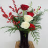 Roses, Stock, berries, green in tall glass red vase 